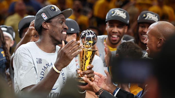 May 31, 2025; Indianapolis, Indiana, USA; Indiana Pacers forward Pascal Siakam (43) receives the Larry Bird MVP Trophy from Reggie Miller after game six of the eastern conference finals against the New York Knicks for the 2025 NBA Playoffs at Gainbridge Fieldhouse. Mandatory Credit: Trevor Ruszkowski-Imagn Images