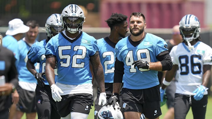 Jun 11, 2025; Charlotte, NC, USA; Carolina Panthers linebacker DJ Johnson (52) and linebacker Jon Rhattigan (49) during minicamp at Bank of America Stadium. Mandatory Credit: Jim Dedmon-Imagn Images