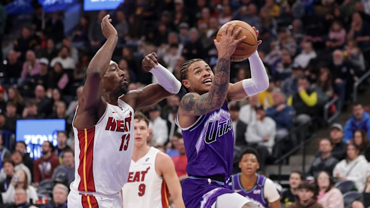 Jan 24, 2026; Salt Lake City, Utah, USA;  Utah Jazz guard Keyonte George (3) tries to get past Miami Heat center/forward Bam Adebayo (13) and to the basket during the second half at Delta Center. Mandatory Credit: Chris Nicoll-Imagn Images