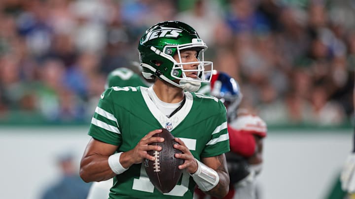 Aug 24, 2024; East Rutherford, New Jersey, USA; New York Jets quarterback Adrian Martinez (15) drops back to pass against the New York Giants during the first half at MetLife Stadium. Mandatory Credit: Vincent Carchietta-Imagn Images