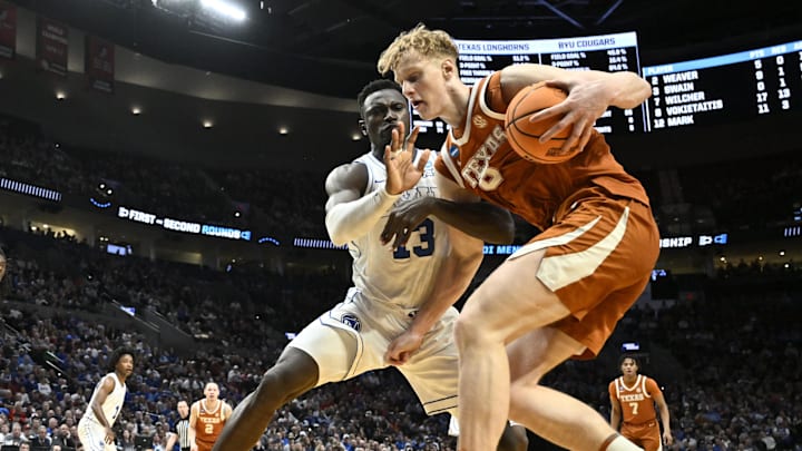 Mar 19, 2026; Portland, OR, USA; Texas Longhorns center Matas Vokietaitis (8) drives against BYU Cougars center Keba Keita (13) in the second half during a first round game of the men's 2026 NCAA Tournament at Moda Center. Mandatory Credit: Craig Strobeck-Imagn Images Mar 19, 2026; Portland, OR, USA; Texas Longhorns center Matas Vokietaitis (8) drives against BYU Cougars center Keba Keita (13) in the second half during a first round game of the men's 2026 NCAA Tournament at Moda Center. Mandatory Credit: Craig Strobeck-Imagn Images