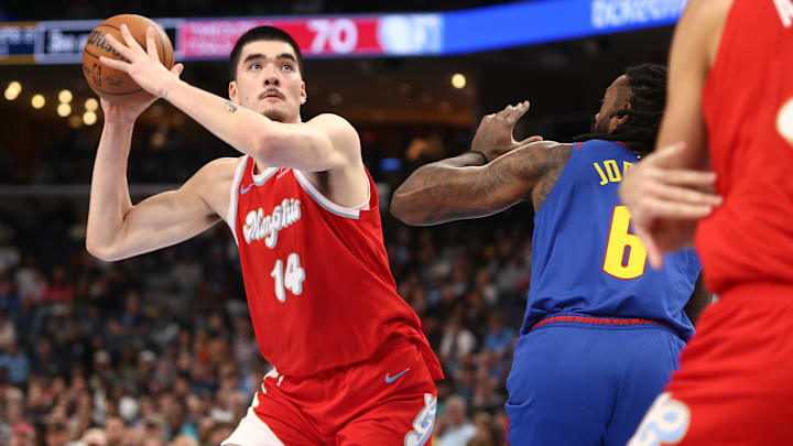 Nov 17, 2024; Memphis, Tennessee, USA; Memphis Grizzlies center Zach Edey (14) shoots during the second half against the Denver Nuggets at FedExForum. Mandatory Credit: Petre Thomas-Imagn Images