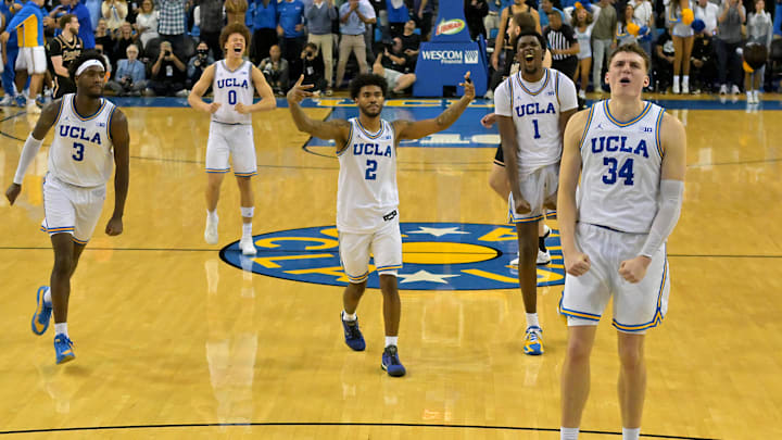 Jan 20, 2026; Los Angeles, California, USA; UCLA Bruins guard Eric Dailey Jr. (3), guard Trent Perry (0), guard Donovan Dent (2) and forward Xavier Booker (1) celebrate after a 3-point basket by forward Tyler Bilodeau (34) in the final seconds of the game against the Purdue Boilermakers in the second half at Pauley Pavilion presented by Wescom Financial. Mandatory Credit: Jayne Kamin-Oncea-Imagn Images