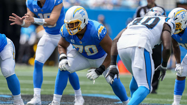 Sep 15, 2024; Charlotte, North Carolina, USA; Los Angeles Chargers offensive tackle Rashawn Slater (70) in his stance against the Carolina Panthers during the second quarter at Bank of America Stadium. Mandatory Credit: Jim Dedmon-Imagn Images