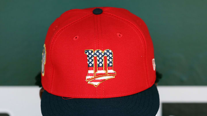 Minnesota Twins players wear commemorative hats as seen before the game against the Oakland Athletics at Oakland Coliseum in 2019.