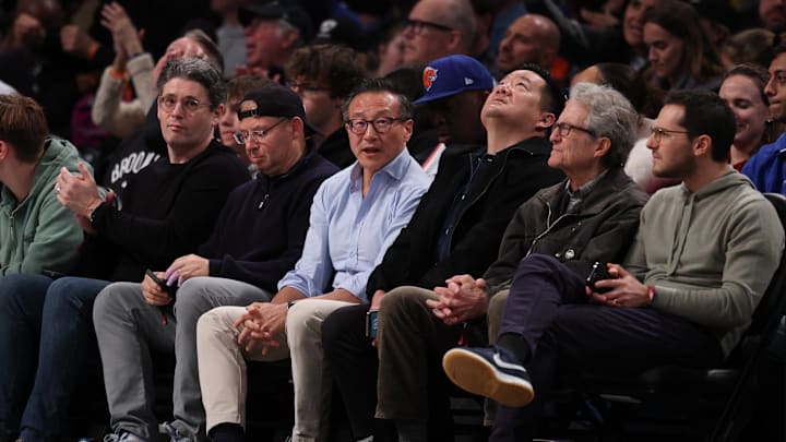 Apr 13, 2025; Brooklyn, New York, USA; Brooklyn Nets owner Joseph Tsai (center) sits curtsied during the first half of the game between the Nets and the New York Knicks at Barclays Center. Mandatory Credit: Vincent Carchietta-Imagn Images