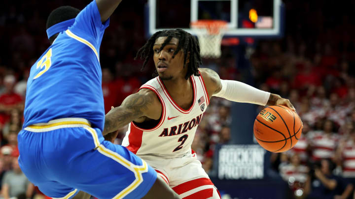Jan 20, 2024; Tucson, Arizona, USA; Arizona Wildcats guard Caleb Love (2) dribbles the ball agaisnt UCLA Bruins forward Adem Bona (3) during the second half at McKale Center
