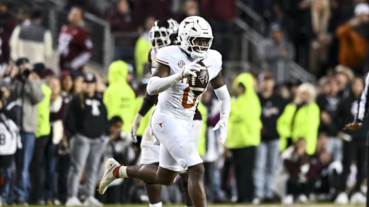 Nov 30, 2024; College Station, Texas, USA; Texas Longhorns linebacker Anthony Hill Jr. (0) reacts after recovering a fumble during the fourth quarter against the Texas A&M Aggies. The Longhorns defeated the Aggies 17-7. at Kyle Field. Mandatory Credit: Maria Lysaker-Imagn Images 