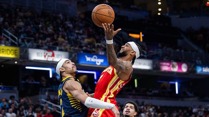 Jan 31, 2026; Indianapolis, Indiana, USA; Atlanta Hawks guard Nickeil Alexander-Walker (7) shoots the ball while Indiana Pacers guard/forward Andrew Nembhard (2) defends in the second half at Gainbridge Fieldhouse. Mandatory Credit: Trevor Ruszkowski-Imagn Images Jan 31, 2026; Indianapolis, Indiana, USA; Atlanta Hawks guard Nickeil Alexander-Walker (7) shoots the ball while Indiana Pacers guard/forward Andrew Nembhard (2) defends in the second half at Gainbridge Fieldhouse. Mandatory Credit: Trevor Ruszkowski-Imagn Images