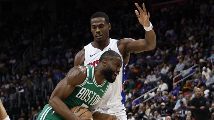 Jan 19, 2026; Detroit, Michigan, USA;  Boston Celtics guard Jaylen Brown (7) dribbles against Detroit Pistons center Jalen Duren (0) in the first half at Little Caesars Arena. Mandatory Credit: Rick Osentoski-Imagn Images