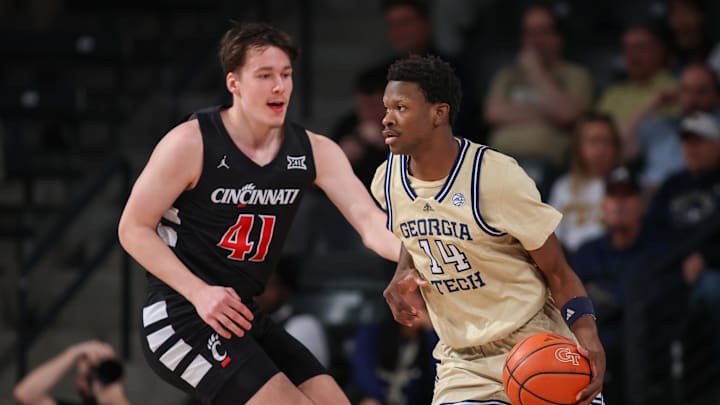 Nov 23, 2024; Atlanta, Georgia, USA; Cincinnati Bearcats guard Simas Lukosius (41) defends Georgia Tech Yellow Jackets guard Kowacie Reeves Jr. (14) in the first half at McCamish Pavilion. Mandatory Credit: Brett Davis-Imagn Images
