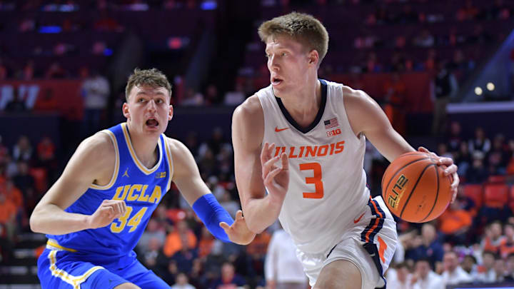 Feb 11, 2025; Champaign, Illinois, USA;  Illinois Fighting Illini forward Ben Humrichous (3) drives the ball past UCLA Bruins forward Tyler Bilodeau (34) during the first half at State Farm Center. Mandatory Credit: Ron Johnson-Imagn Images