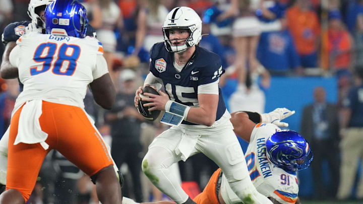 Penn State Nittany Lions quarterback Drew Allar (15) scrambles out of the backfield against the Boise State Broncos during their Fiesta Bowl matchup at State Farm Stadium.