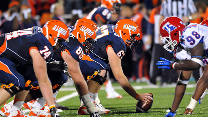 Sep 22, 2012; Champaign, IL, USA; Illinois Fighting Illini offensive line against the Louisiana Tech Bulldogs defense during the second quarter at Memorial Stadium. Mandatory Credit: Bradley Leeb-Imagn Images Sep 22, 2012; Champaign, IL, USA; Illinois Fighting Illini offensive line against the Louisiana Tech Bulldogs defense during the second quarter at Memorial Stadium. Mandatory Credit: Bradley Leeb-Imagn Images