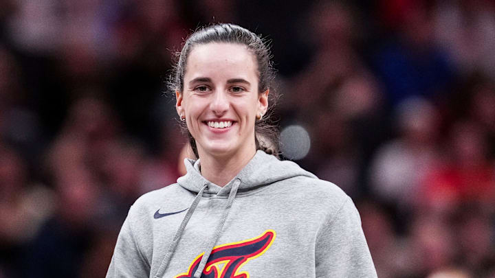 Indiana Fever Caitlin Clark (22) smiles Saturday, May 3, 2025, during a timeout at a preseason game between the Indiana Fever and the Washington Mystics at Gainbridge Fieldhouse in Indianapolis.