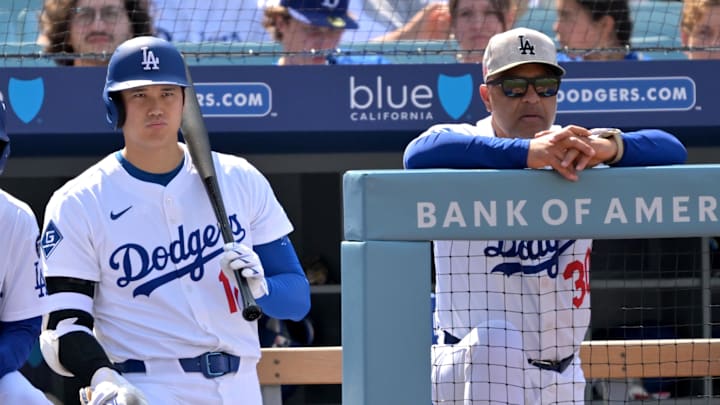May 18, 2025; Los Angeles, California, USA;  Los Angeles Dodgers designated hitter Shohei Ohtani (17) and manager Dave Roberts (30) look on from the dugout in the seventh inning against the Los Angeles Angels at Dodger Stadium. Mandatory Credit: Jayne Kamin-Oncea-Imagn Images