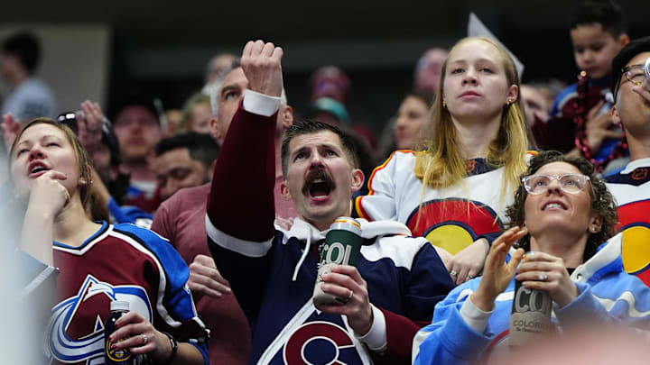 Feb 28, 2026; Denver, Colorado, USA; Colorado Avalanche fans celebrate a goal in the third period against the Chicago Blackhawks at Ball Arena. Mandatory Credit: Ron Chenoy-Imagn Images