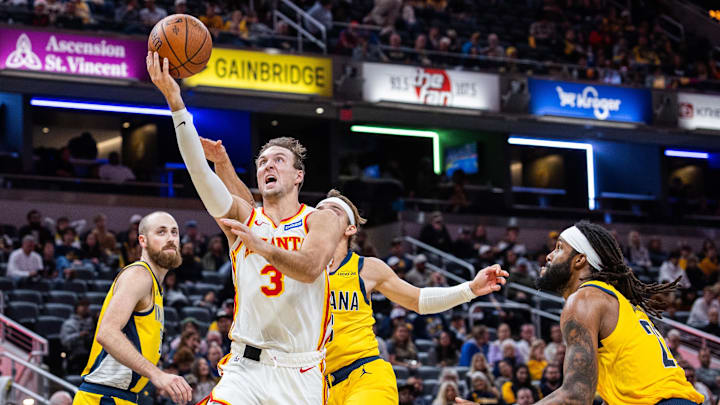 Oct 31, 2025; Indianapolis, Indiana, USA; Atlanta Hawks guard Luke Kennard (3) shoots the ball while Indiana Pacers guard Mac McClung (3) defends in the second half at Gainbridge Fieldhouse. Mandatory Credit: Trevor Ruszkowski-Imagn Images
