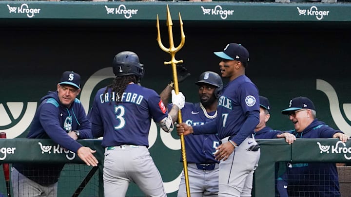 Seattle Mariners shortstop J.P. Crawford (3) is presented with a trident from third baseman Jorge Polanco (7) after hitting a solo home run during the first inning against the Texas Rangers at Globe Life Field on May 3.