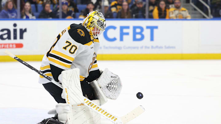 Apr 6, 2025; Buffalo, New York, USA;  Boston Bruins goaltender Joonas Korpisalo (70) looks to make a save during the second period against the Buffalo Sabres at KeyBank Center. Mandatory Credit: Timothy T. Ludwig-Imagn Images