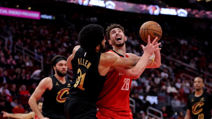 Jan 22, 2025; Houston, Texas, USA; Houston Rockets center Alperen Sengun (28) is fouled by Cleveland Cavaliers center Jarrett Allen (31) during the third quarter at Toyota Center. Mandatory Credit: Erik Williams-Imagn Images