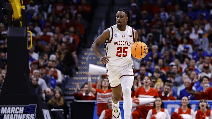 Mar 22, 2025; Denver, CO, USA; Wisconsin Badgers guard John Blackwell (25) dribbles the ball against the Brigham Young Cougars during the first half in the second round of the NCAA Tournament  at Ball Arena. Mandatory Credit: Isaiah J. Downing-Imagn Images