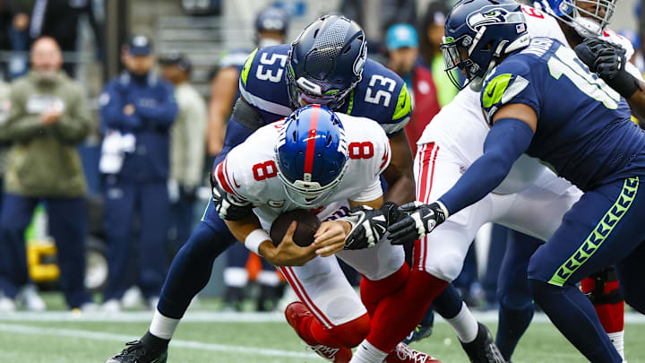 Oct 30, 2022; Seattle, Washington, USA; Seattle Seahawks linebacker Boye Mafe (53) sacks New York Giants quarterback Daniel Jones (8) during the second quarter at Lumen Field. Seattle Seahawks linebacker Uchenna Nwosu (10) closes in from the right. Mandatory Credit: Joe Nicholson-Imagn Images