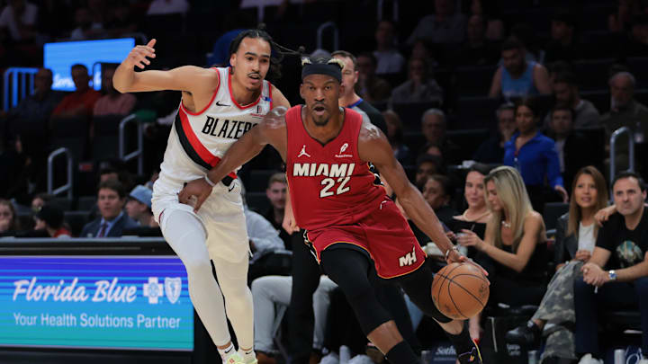 Jan 21, 2025; Miami, Florida, USA; Miami Heat forward Jimmy Butler (22) drives to the basket past Portland Trail Blazers guard Dalano Banton (5) during the first quarter at Kaseya Center. Mandatory Credit: Sam Navarro-Imagn Images Jan 21, 2025; Miami, Florida, USA; Miami Heat forward Jimmy Butler (22) drives to the basket past Portland Trail Blazers guard Dalano Banton (5) during the first quarter at Kaseya Center. Mandatory Credit: Sam Navarro-Imagn Images