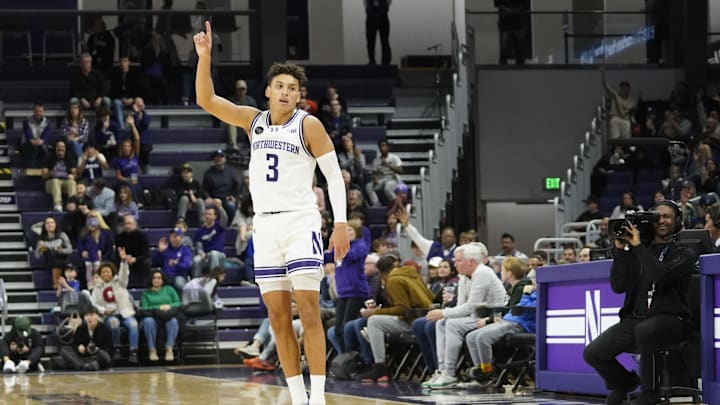 Dec 29, 2023; Evanston, Illinois, USA; Northwestern Wildcats guard Ty Berry (3) celebrates his three