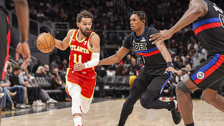 Jan 22, 2025; Atlanta, Georgia, USA; Atlanta Hawks guard Trae Young (11) dribbles against Detroit Pistons forward Ausar Thompson (9) during the second half at State Farm Arena. Mandatory Credit: Dale Zanine-Imagn Images