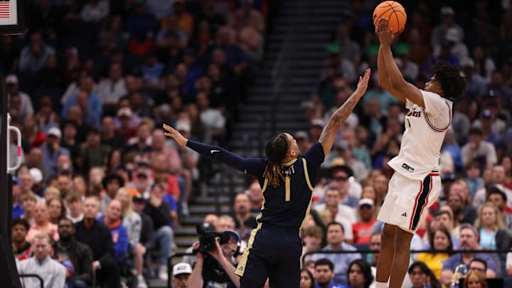 Mar 20, 2026; Tampa, FL, USA; Texas Tech Red Raiders guard Jaylen Petty (11) shoots against Akron Zips guard Shammah Scott (1) in the second half during a first round game of the men's 2026 NCAA Tournament at Benchmark International Arena. Mandatory Credit: Matt Pendleton-Imagn Images