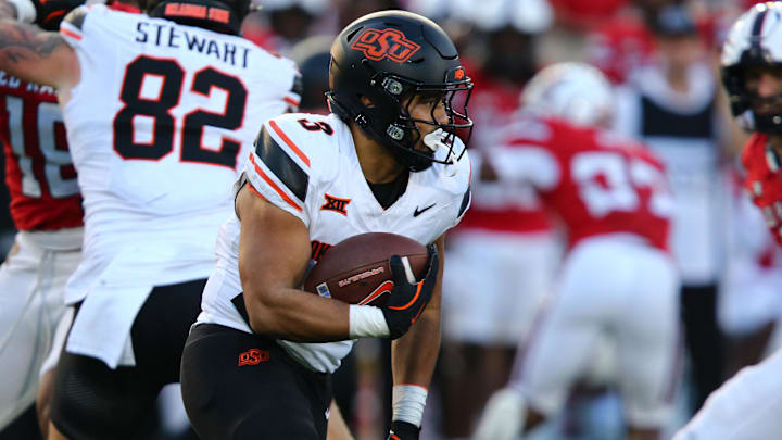 Oct 25, 2025; Lubbock, Texas, USA;  Oklahoma State Cowboys running back Sesi Vailahi (3) rushes against the Texas Tech Red Raiders in the second half at Jones AT&T Stadium. Mandatory Credit: Michael C. Johnson-Imagn Images