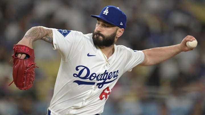 Los Angeles Dodgers relief pitcher Tanner Scott (66) earns a save in the ninth inning against the Arizona Diamondbacks at Dodger Stadium. 