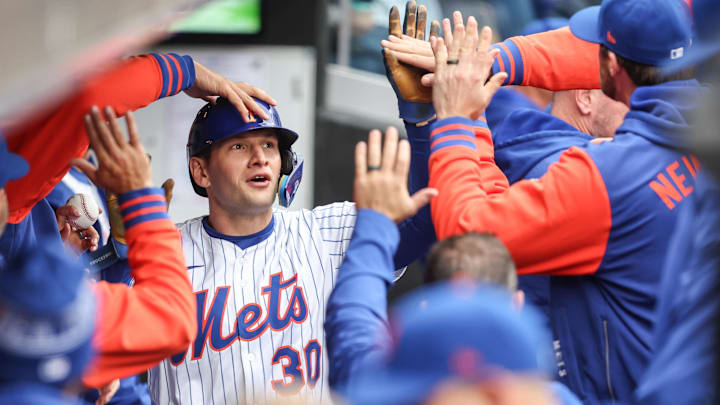 New York Mets catcher Hayden Senger (30) is greeted in the dugout after scoring in the third inning against the Toronto Blue Jays at Citi Field in New York on April 6, 2025. New York Mets catcher Hayden Senger (30) is greeted in the dugout after scoring in the third inning against the Toronto Blue Jays at Citi Field in New York on April 6, 2025.