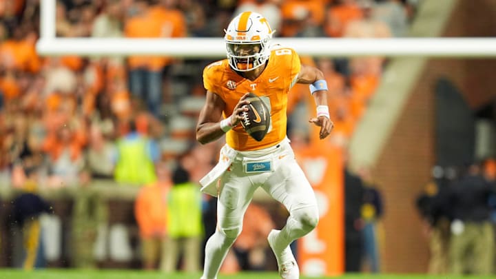 Nov 9, 2024; Knoxville, Tennessee, USA; Tennessee Volunteers quarterback Nico Iamaleava (8) rolls out to pass against the Mississippi State Bulldogs during the first half at Neyland Stadium. Mandatory Credit: Caitie McMekin/USA TODAY Network via Imagn Images
