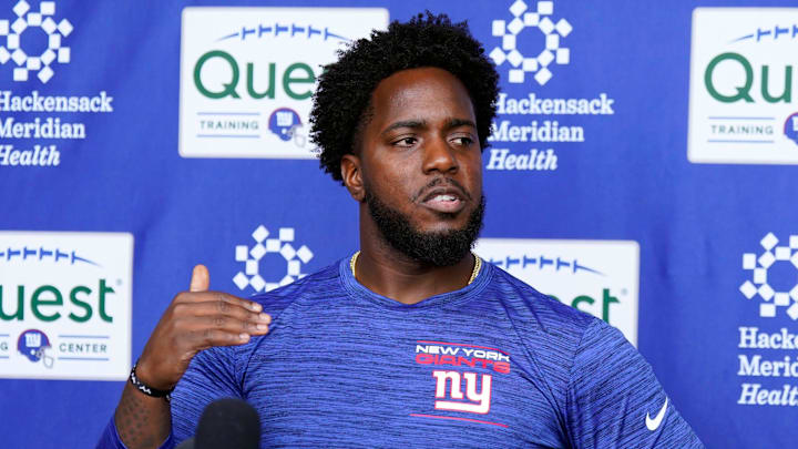 New York Giants assistant general manager Brandon Brown talks to reporters after the first day of