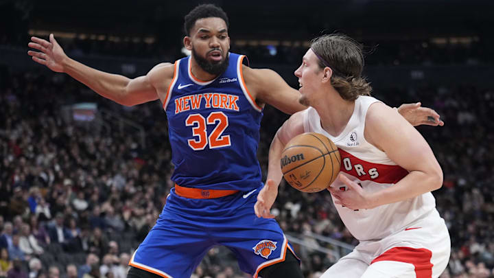 Feb 4, 2025; Toronto, Ontario, CAN; New York Knicks center Karl-Anthony Towns (32)  defends against the Toronto Raptors forward Kelly Olynyk (41) during the second half at Scotiabank Arena. Mandatory Credit: John E. Sokolowski-Imagn Images