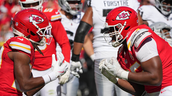 Oct 19, 2025; Kansas City, Missouri, USA; Kansas City Chiefs cornerback Nohl Williams (20) and defensive end Chris Jones (95) celebrates after a sack against the Las Vegas Raiders withduring the third quarter of the game at GEHA Field at Arrowhead Stadium. Mandatory Credit: Denny Medley-Imagn Images