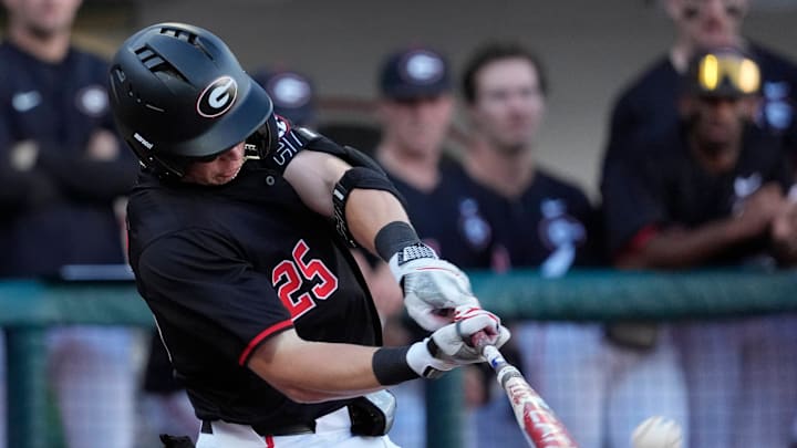 Georgia catcher Daniel Jackson (25) hits the ball during a NCAA baseball game against Arkansas in Athens, Ga., on Friday, April 11, 2025. Georgia catcher Daniel Jackson (25) hits the ball during a NCAA baseball game against Arkansas in Athens, Ga., on Friday, April 11, 2025.