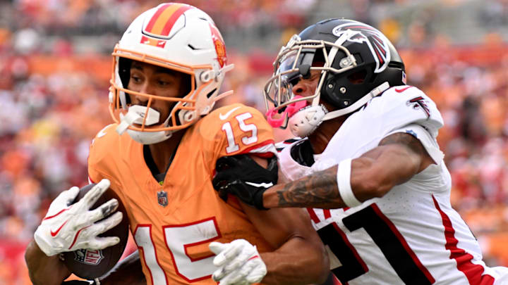 Tampa Bay Buccaneers wide receiver Jalen McMillan (15) gets tackled by Atlanta Falcons defensive back Mike Hughes