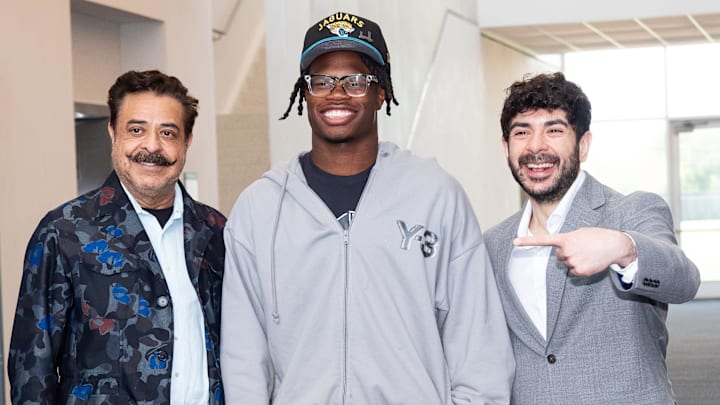 The Jacksonville Jaguars first-round pick, Colorado Buffaloes wide receiver and defensive back Travis Hunter, center, was greeted by Jaguars owner Shahid Khan, left, and his son Tony Khan, right, after Hunter arrived on Friday, March 25, 2025 at Miller Electric Center in Jacksonville, Fla. The team traded up from fifth to second after making a deal with the Cleveland Browns on Thursday night. [Doug Engle/Florida Times-Union]