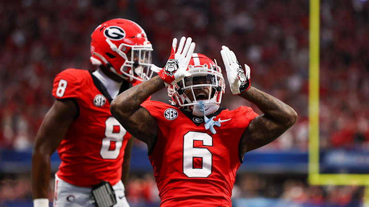 Aug 31, 2024; Atlanta, Georgia, USA; Georgia Bulldogs wide receiver Dominic Lovett (6) reacts after a catch with wide receiver Colbie Young (8) against the Clemson Tigers in the third quarter at Mercedes-Benz Stadium. Mandatory Credit: Brett Davis-Imagn Images