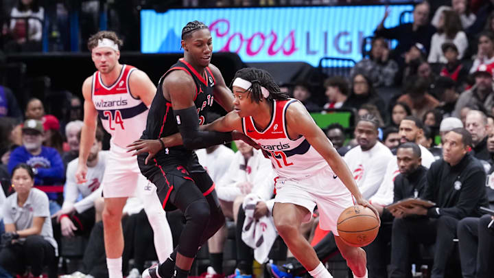 Nov 21, 2025; Toronto, Ontario, CAN; Tre Johnson (12) of the Washington Wizards dribbles against RJ Barrett (9) of the Toronto Raptors during the second half at Scotiabank Arena. Mandatory Credit: Kevin Sousa-Imagn Images Nov 21, 2025; Toronto, Ontario, CAN; Tre Johnson (12) of the Washington Wizards dribbles against RJ Barrett (9) of the Toronto Raptors during the second half at Scotiabank Arena. Mandatory Credit: Kevin Sousa-Imagn Images