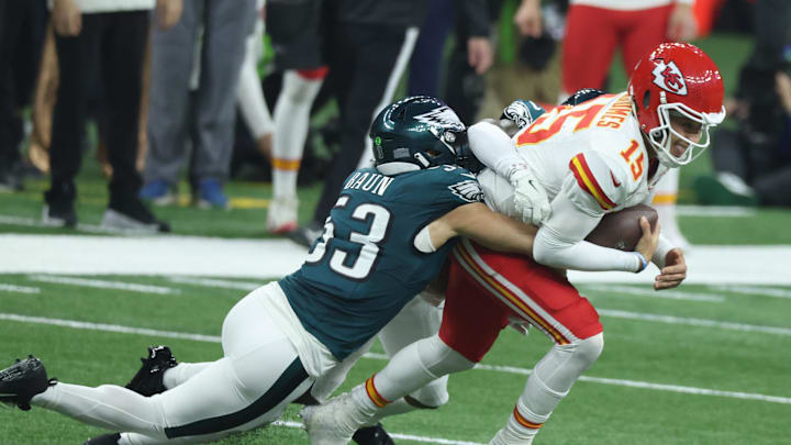 Feb 9, 2025; New Orleans, LA, USA;  Kansas City Chiefs quarterback Patrick Mahomes (15) is tackled by Philadelphia Eagles linebacker Zack Baun (53) in Super Bowl LIX between the Philadelphia Eagles and the Kansas City Chiefs at Ceasars Superdome. Mandatory Credit: Stephen Lew-Imagn Images