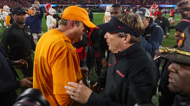 Nov 16, 2024; Athens, Georgia, USA; Tennessee Volunteers head coach Josh Heupel talks to Georgia Bulldogs head coach Kirby Smart after a game at Sanford Stadium. Mandatory Credit: Brett Davis-Imagn Images
