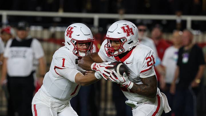 Houston Cougars quarterback Conner Weigman gives the ball to running back Makhi Huges against the Texas Tech Red Raiders. Mandatory Credit: Michael C. Johnson-Imagn Images Houston Cougars quarterback Conner Weigman gives the ball to running back Makhi Huges against the Texas Tech Red Raiders. Mandatory Credit: Michael C. Johnson-Imagn Images