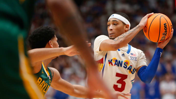Kansas redshirt senior guard Dajuan Harris Jr. (3) protects the ball from Baylor in the first half