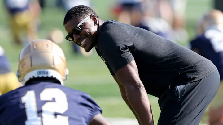Notre Dame running backs coach Deland McCullough confers with freshman RB Jeremiyah Love during Notre Dame football fall camp Thursday, July 27, 2023, at the LaBar Practice Complex in South Bend.