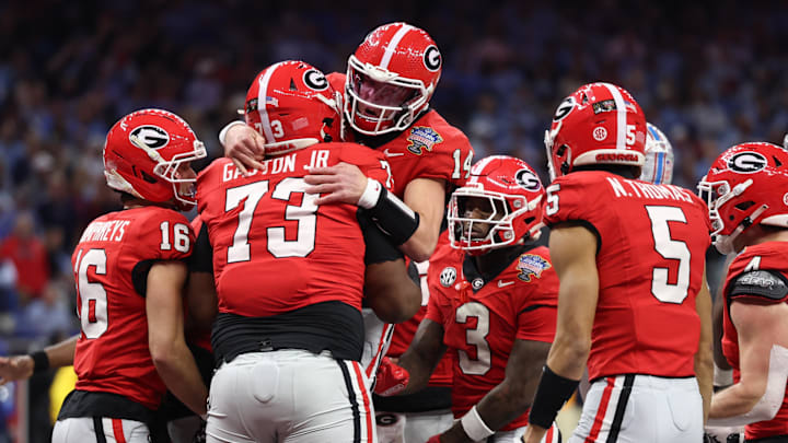 Jan 1, 2026; New Orleans, LA, USA; Georgia Bulldogs quarterback Gunner Stockton (14) celebrates with teammates after scoring a touchdown against the Mississippi Rebels in the second quarter during the 2026 Sugar Bowl and quarterfinal game of the College Football Playoff at Caesars Superdome. Mandatory Credit: Stephen Lew-Imagn Images