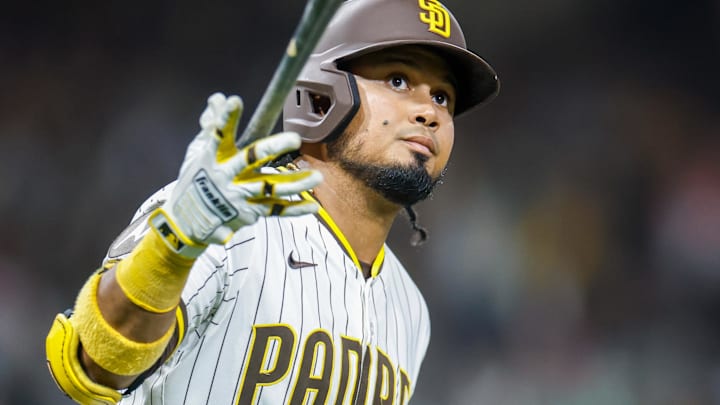 Apr 14, 2025; San Diego, California, USA; San Diego Padres first baseman Luis Arraez (4) celebrates after hitting a one run home run during the eighth inning against the Chicago Cubs at Petco Park. Mandatory Credit: David Frerker-Imagn Images